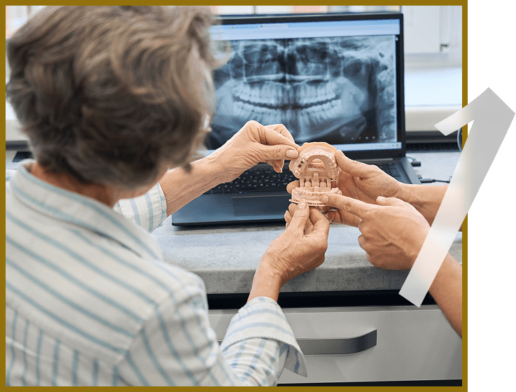 dentist showing patient tooth implant xray and model